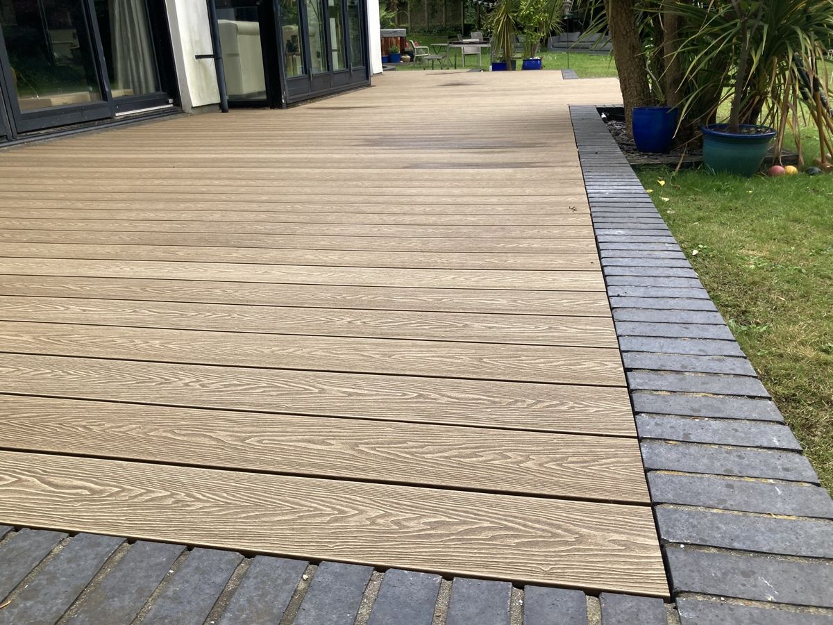Composite deck with brick edging