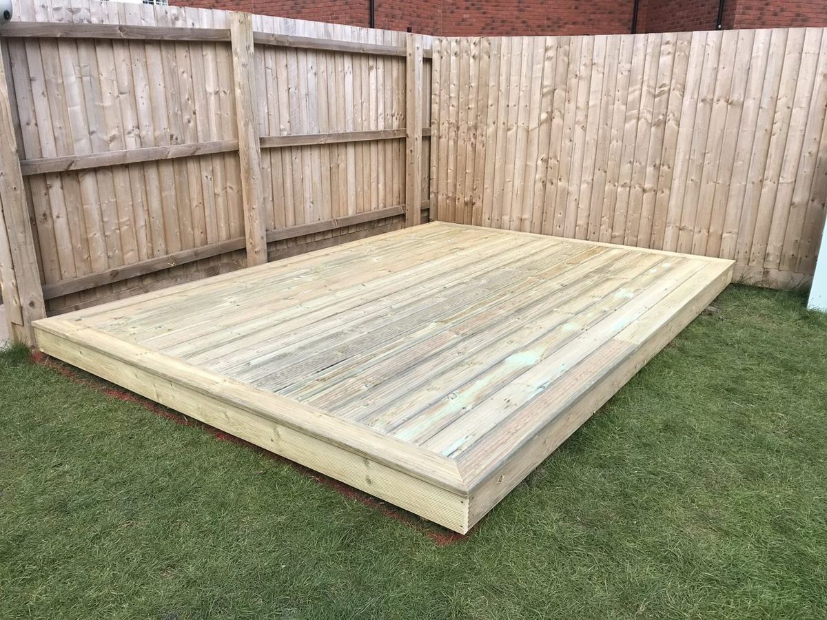 Floating deck in a fenced corner