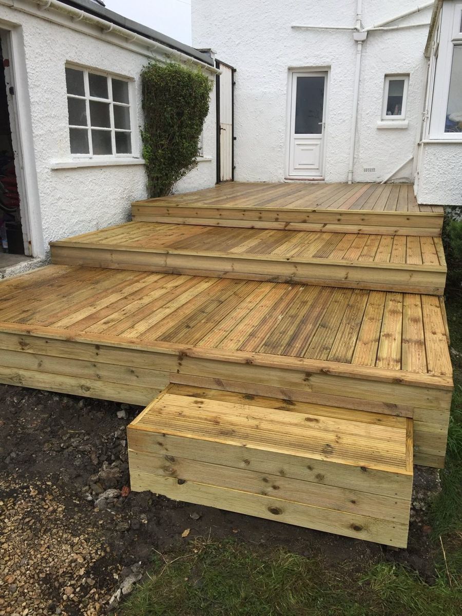 Tiered deck stepping down from the house