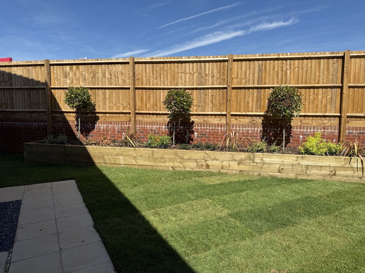 Fence and sleeper bed, wide view