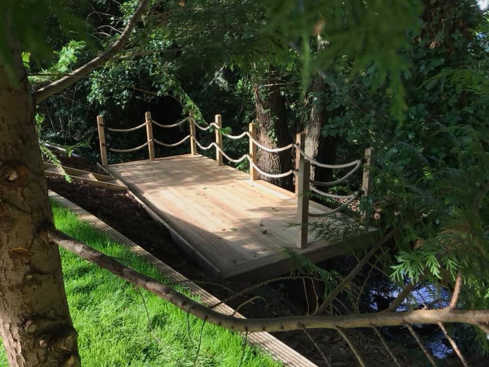 Woodland deck platform with rope balustrade