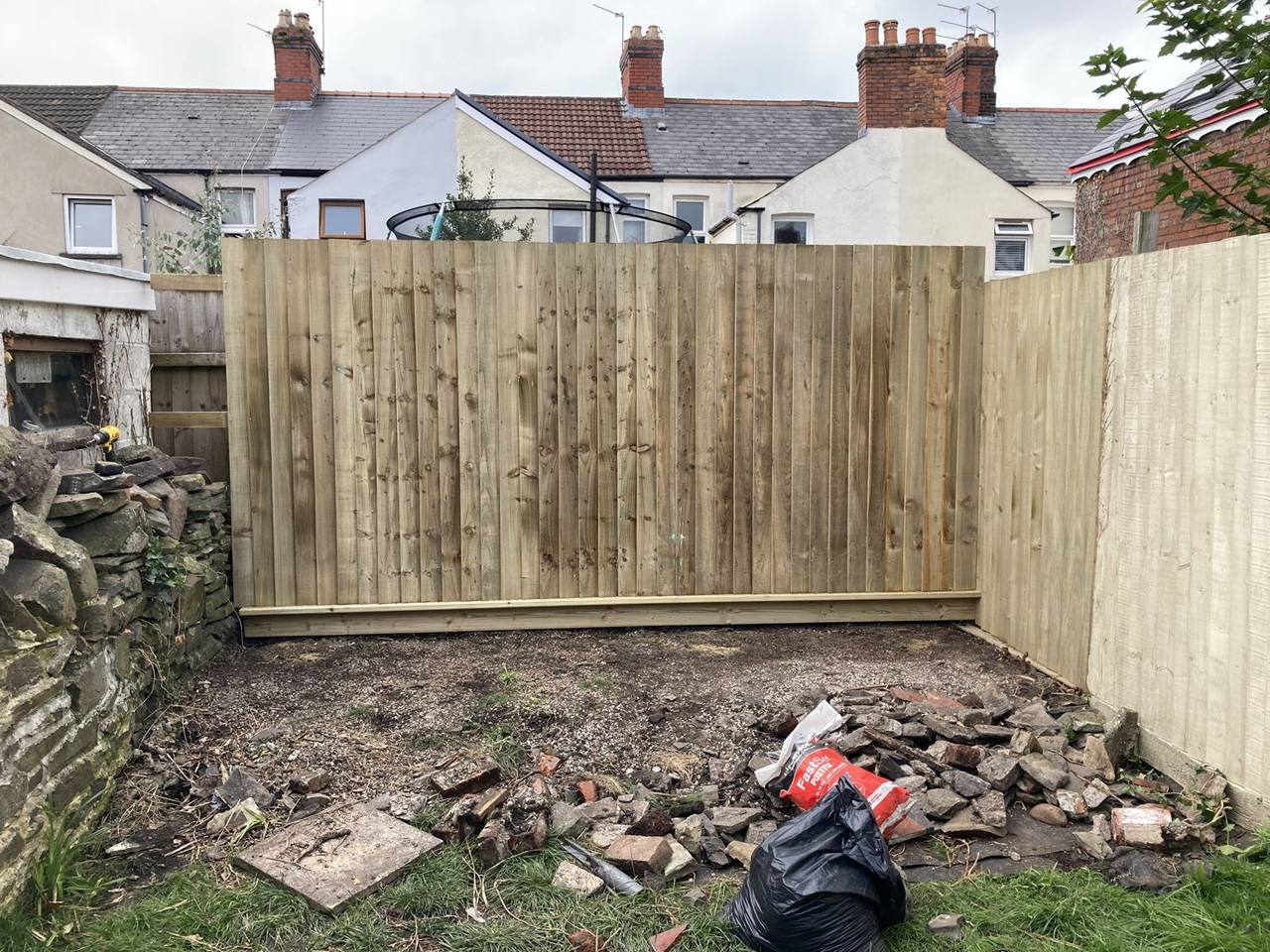 Finished featheredge fence with boards nailed to the rails